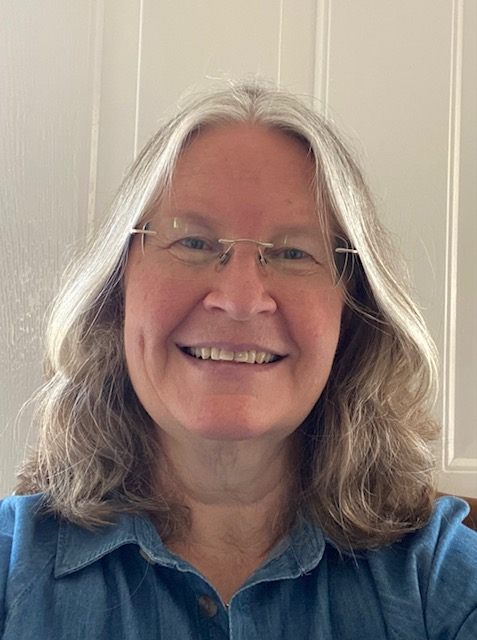 Portrait of counsellor Anna Tweedie smiling against a light background – warm and welcoming image.